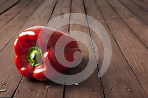 Red bell pepper on brown table