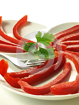 Red bell pepper slices, closeup, isolated