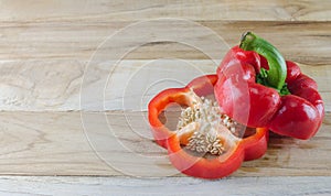 Red bell pepper on wooden