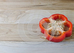 Red bell pepper on wooden