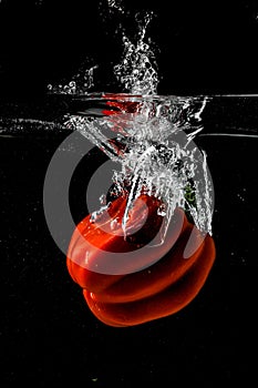 Red bellpepper splashing