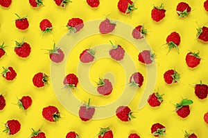 Red berry raspberries on yellow background.