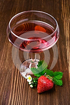 Red beverage with strawberry