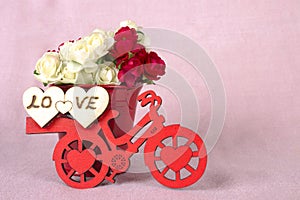 Red bicycle with a bucket of flowers & pink, heart
