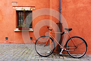 Red bicycle near old house in Rimini