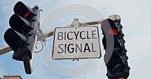 Red bicycle signal flashes, guides city cyclists, bike sign symbolizes safe, eco-friendly urban travel. Vibrant bicycle