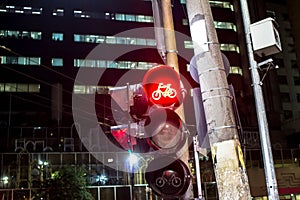 Red bicycle traffic light at Republica Square at night