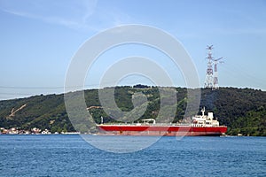 A red big freighter in Bosphorus