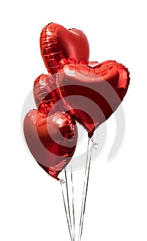 Red big heart metallic balloons on white