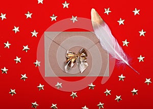 Red big heart-shaped gift with bow for Valentine`s Day on a red background