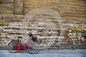 Red Bike Against Brick Wall