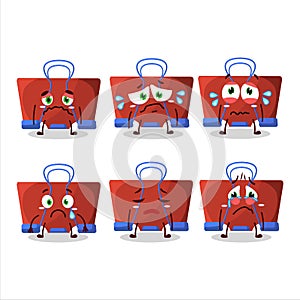 Red binder clip cartoon character with sad expression