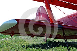 red biplane wing on the ground