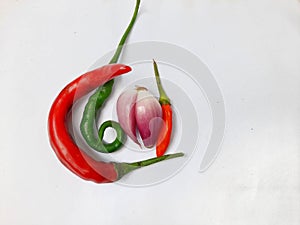 Red bird\'s eye chilies, green chilies and shallots are the basic ingredients for Indonesian spices