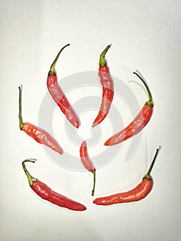 Red bird's eye chilies are very spicy.