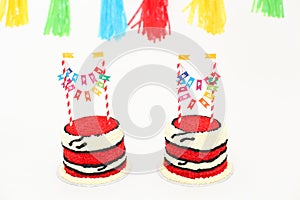 Red birthday cake with banners