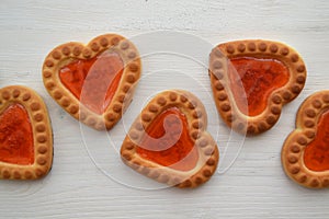 Red biscuit on white background. Gingerbread couple. Heart symbol. Love postcard