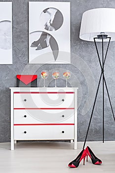 Red and black accessories in bedroom