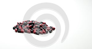 Red, black antibiotic capsule pills isolated on white background with copy space