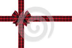 Red and black buffalo plaid Christmas gift bow and ribbon arranged as wrapped gift box isolated on white