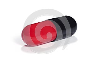 Red and black capsule with medicine