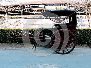 Red and black cart with false convertible area