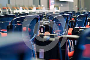 Red and black conference chairs in the auditorium