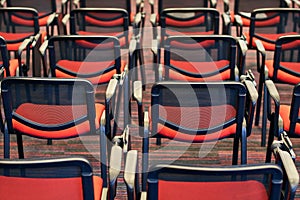 Red and black conference chairs in the auditorium