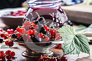 Red and black currants. red currant jam with fresh berry