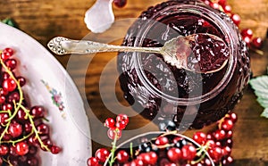 Red and black currants. red currant jam with fresh berry