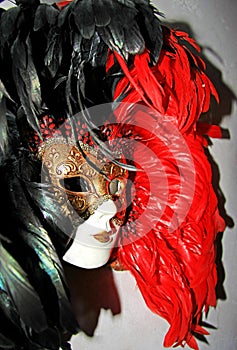 Red and black decorative theater mask, white face, carnival objects accessories