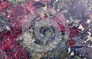 Red and black eudialyte texture macro