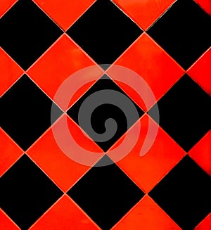 Red and black mosaic ceramic tile abstract pattern interior surface floor texture background