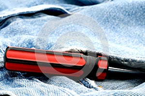 Red and black screwdriver in jeans pocket