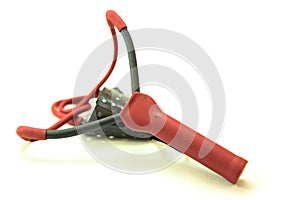 Red and black slingshot on a white background