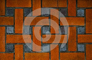 Red and black square brick wall in design, abstract pattern.