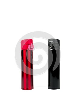 Red and black thermos bottles isolated on white background