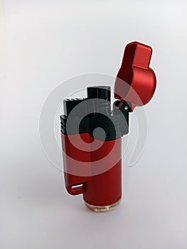Red and black torch lighter isolated on a white background