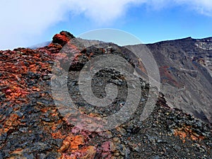 Red and black volcanic rock in the Dolomieu crater, Reunion