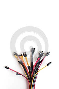 Red, black and yellow data cables on white background. Plenty of negative spa