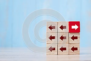 Red block with different direction of arrow on table background. Business Growth, Improvement, strategy, Successful, different and