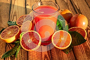 Red Blood Oranges Juice With Fresh Fruits On Wooden Background