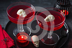 Red bloody berry jelly with white chocolate sculls