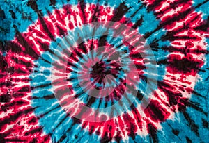 Red, Blue and Black Retro Abstract Psychedelic Tie Dye Swirl Design on cotton shirt.