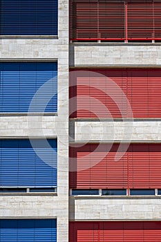 Red and blue blinds on the windows
