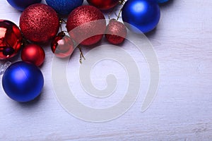 Red and blue christmas balls on a wooden background