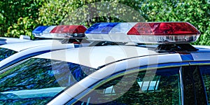 Red and blue flashes on the cars of the Patrol specialized unity. Police lights on car during traffic surveillance.