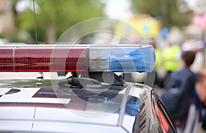 red and blue flashing lights of police patrol during an uprising