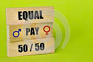 Red and blue gender symbol, written on a wooden block Equal, Pay, 50/50, Creative concept of gender equality, Equal pay and