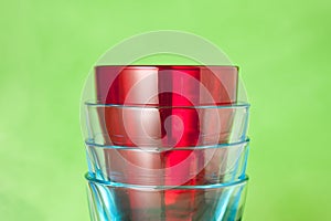 Red and blue glasses on a green background